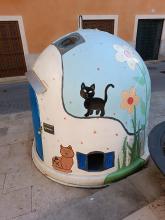 Cat painted on a waste container